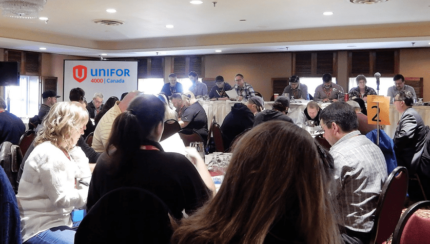 Photo from 2013 Unifor convention with Andrew at head table as part of the Resolutions and Bylaws committee